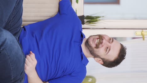 Vertical-video-of-Positive-man-happy-and-smiling.